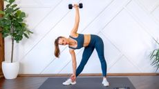 a photo of a woman doing a standing ab workout