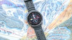 Polar Vantage M3 close up of the main watch face with the device resting on a ski mountain map